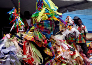 Children dressed in Masquerade costumes on stage